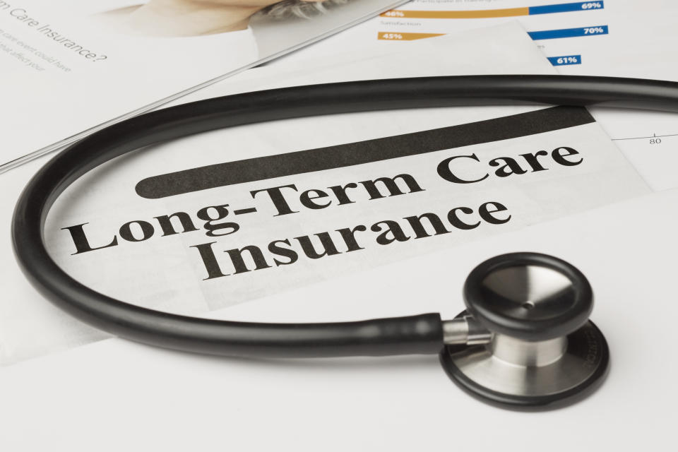 Long-term care insurance information, form and stethoscope.  