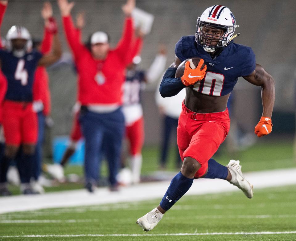 Pike Road's Anthony Rogers bras free for a touchdown against Pleasant Grove in the AHSAA Class 5A State Football Championship Game at Protective Stadium in Birmingham, Ala., on Thursday December 2, 2021.