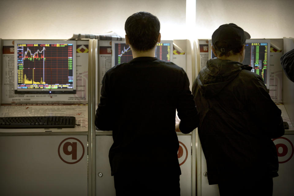 Chinese investors use computer terminals to monitor stock prices at a brokerage house in Beijing, Wednesday, Feb. 27, 2019. Asian shares were higher in muted trading Wednesday as investors watch the second summit between President Donald Trump and North Korean leader Kim Jong Un in Vietnam. (AP Photo/Mark Schiefelbein)