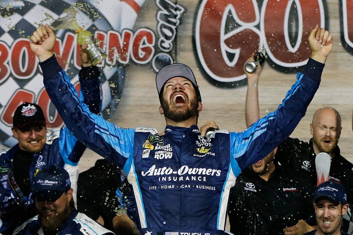 Martin Truex Jr. celebrates in Victory Lane after winning the Monster Energy NASCAR Cup Series Go Bowling 400 at Kansas Speedway. (Photo by Jonathan Ferrey/Getty Images)