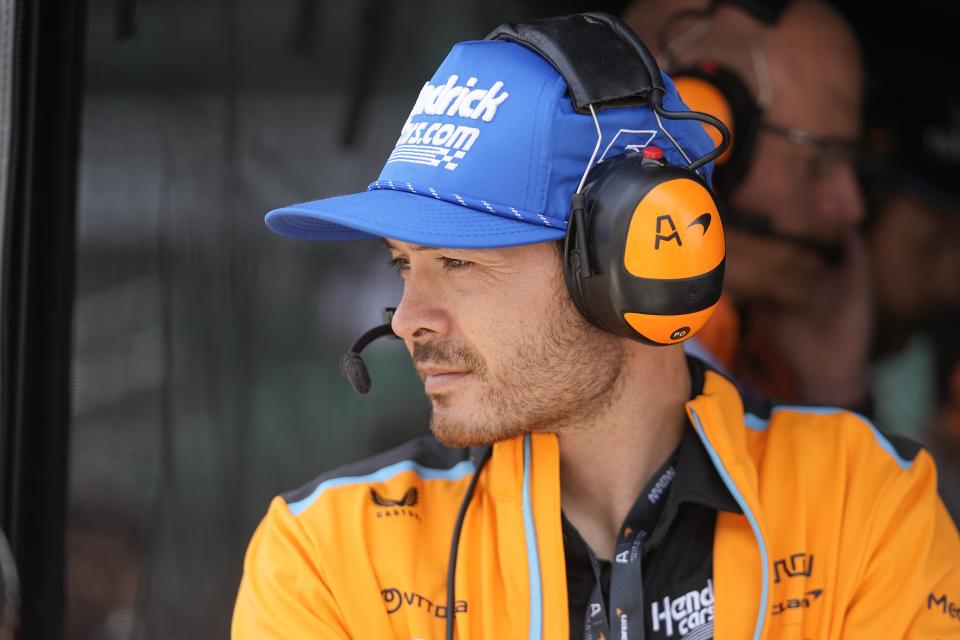 NASCAR's Kyle Larson watches practice for the Indianapolis 500 auto race from an Arrow McLaren pit box at Indianapolis Motor Speedway, Thursday, May 18, 2023, in Indianapolis. Larson announced that he will drive in the 2024 Indianapolis 500 for Arrow McLaren. (AP Photo/Darron Cummings)