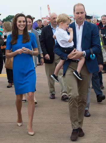 <p>Samir Hussein/WireImage</p> Kate Middleton, Prince George and Prince William at the Royal International Air Tattoo at RAF Fairford on July 8, 2016