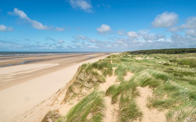 Formby is where locals go to clear the head, take a paddle, or picnic in the dunes - getty