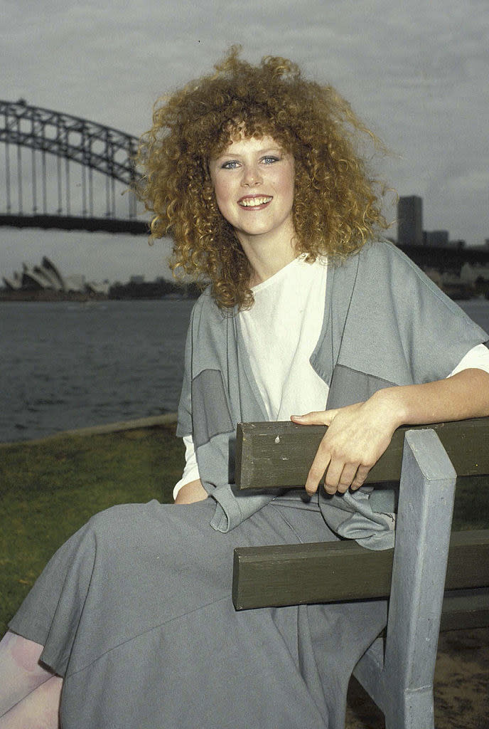 in Sydney with very very curly hair