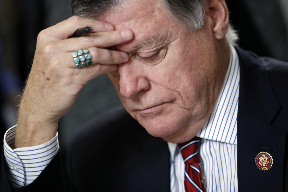 House Rules Committee ranking member Rep. Tom Cole, R-Okla., reads before a House Rules Committee hearing on the impeachment against President Donald Trump, Tuesday, Dec. 17, 2019, on Capitol Hill in Washington. (AP Photo/Andrew Harnik, Pool)