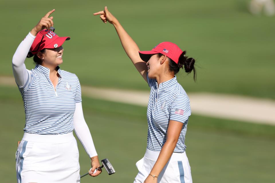 GAINESVILLE, VIRGINIA - SEPTEMBER 14: Alison Lee and Rose Zhang of Team United States react after winning their match on the 14th green during the Saturday Fourball matches against Team Europe during the second round of the Solheim Cup 2024 at Robert Trent Jones Golf Club on September 14, 2024 in Gainesville, Virginia. (Photo by Gregory Shamus/Getty Images)