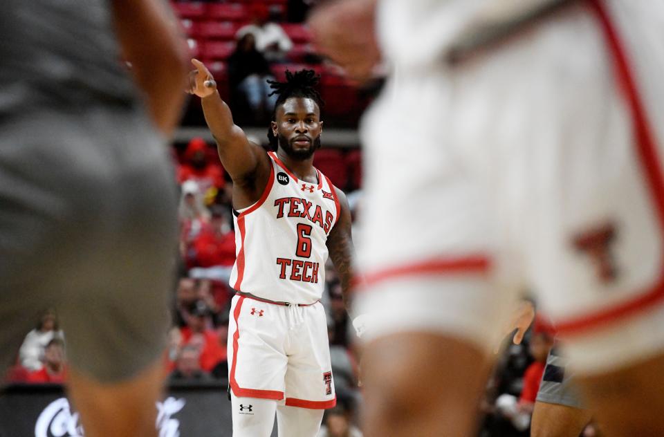 Texas Tech's guard Joe Toussaint (6) points during the non-conference basketball game against Oral Roberts, Tuesday, Dec. 12, 2023, at United Supermarkets Arena.