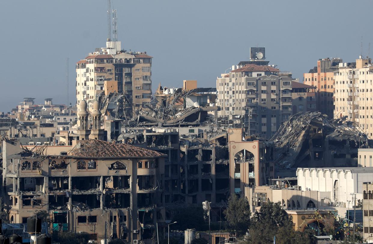 Destroyed and damaged buildings of the Islamic University are seen in the aftermath of Israeli strike (Reuters)