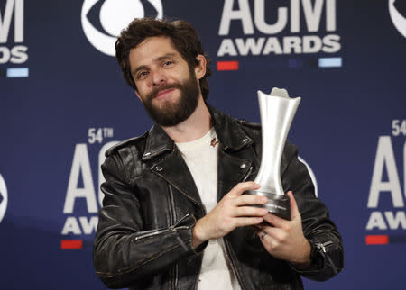 54th Academy of Country Music Awards- Photo room - Las Vegas, Nevada, U.S., April 7, 2019 - Thomas Rhett poses backstage with his Male Artist of the Year award. REUTERS/Steve Marcus