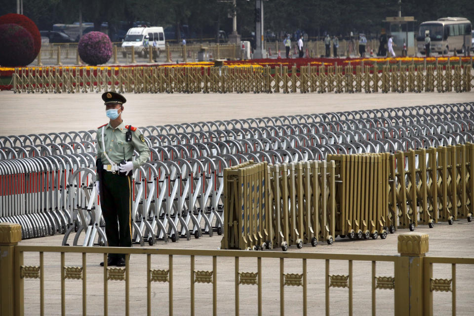 A Chinese paramilitary policeman wearing a face mask to protect against the new coronavirus stands guard on Tiananmen Square before the opening session of the Chinese People's Political Consultative Conference (CPPCC) in Beijing, Thursday, May 21, 2020. (AP Photo/Andy Wong, Pool)