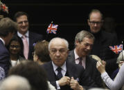 Brexit Party leader Nigel Farage, third right, reacts after the vote on the UK's withdrawal from the EU, the final legislative step in the Brexit proceedings, during the plenary session at the European Parliament in Brussels, Wednesday, Jan. 29, 2020. The U.K. is due to leave the EU on Friday, Jan. 31, 2020, the first nation in the bloc to do so. (Yves Herman, Pool Photo via AP)
