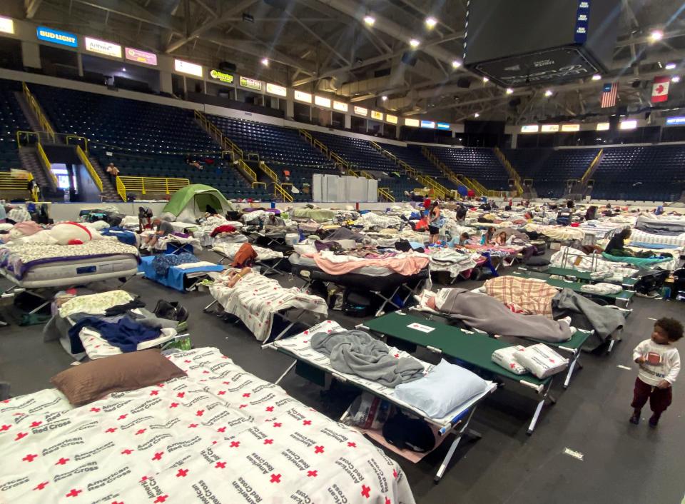 Hundreds of people usingÊthe Hertz Arena in Estero, Fla., as shelter are sleeping in the Florida Everblades hockey rink on Thursday, Oct. 13, 2022. 