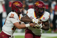 Iowa State quarterback Brock Purdy (15) hands the ball off to running back Breece Hall (28) during the first half of an NCAA college football game against the UNLV, Saturday, Sept. 18, 2021, in Las Vegas. (AP Photo/John Locher)