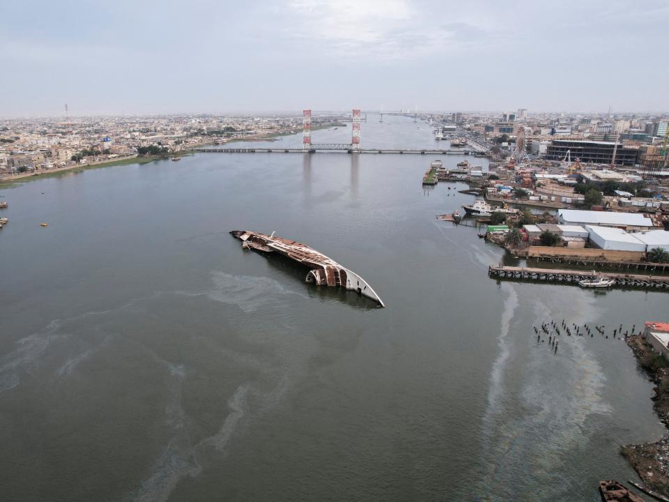 Saddam's rusting yacht serves as picnic spot for Iraqi fishermen.