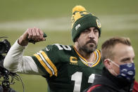 Green Bay Packers quarterback Aaron Rodgers pumps his first after an NFL divisional playoff football game against the Los Angeles Rams Saturday, Jan. 16, 2021, in Green Bay, Wis. The Packers defeated the Rams 32-18 to advance to the NFC championship game. (AP Photo/Morry Gash)