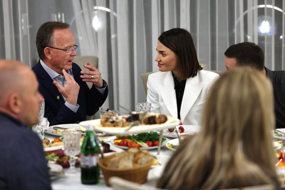 Utah Senate President Stuart Adams talks with Violetta Labazuik, head of the Khmelnytskyi Regional Council, during a reception dinner on Monday, May 1, 2023, in Ukraine. | Scott G Winterton, Deseret News