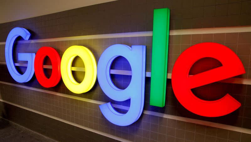 FILE PHOTO: An illuminated Google logo is seen inside an office building in Zurich