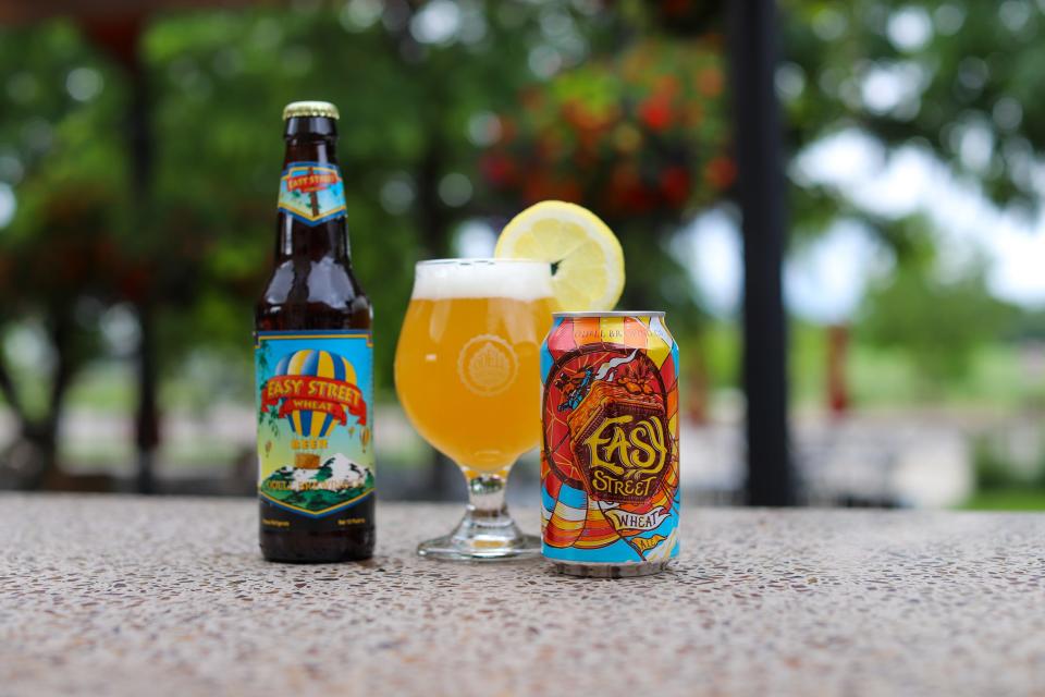 An original Easy Street Wheat bottle from the early 1990s, left, sits next to a new can of the beer, which Odell Brewing brought back in May after a two-year retirement.