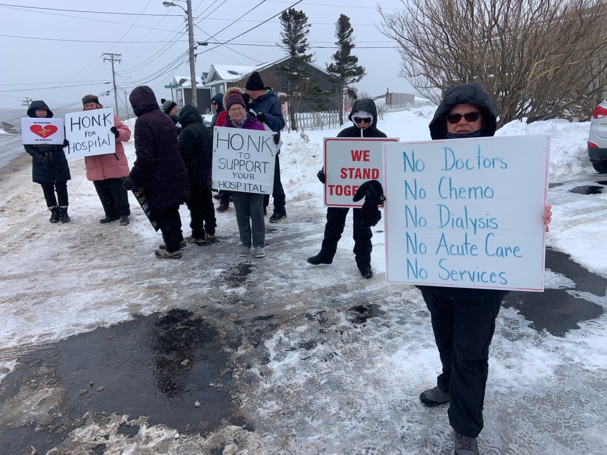 Each week, a group of Bonavista residents hold a rally protesting the state of health care in their community. (Darrell Roberts/CBC - image credit)