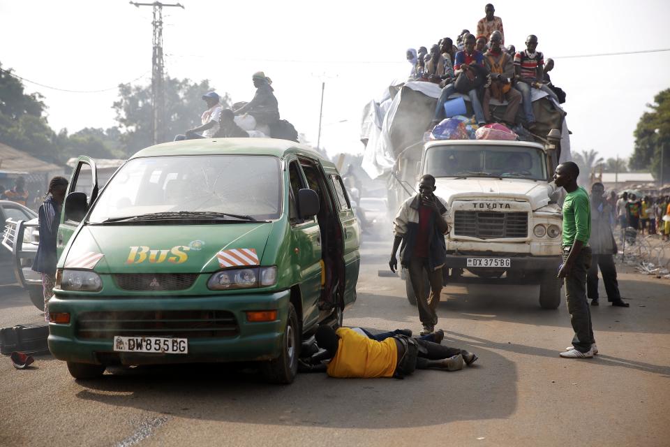 At PK12 thousands of Muslim residents from Bangui and Mbaiki flee the Central African Republic capital Bangui in a mass exodus using cars, pickups, trucks, lorries and motorcycles, escorted by Chadian troops on Friday Feb. 7, 2014. Tit-for-tat violence killed more than 1,000 people in Bangui alone in a matter of days in December. An untold number have died in the weeks that followed, with most of the attacks in Bangui targeting Muslims. (AP Photo/Jerome Delay)