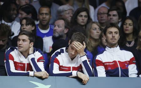 France's Richard Gasquet (C) reacts as he sits between Gilles Simon (L) and Edouard Roger-Vasselin (R) during the Davis Cup final singles tennis match between Switzerland's Stanislas Wawrinka and France's Jo-Wilfried Tsonga at the Pierre-Mauroy stadium in Villeneuve d'Ascq, near Lille, November 21, 2014. REUTERS/Gonzalo Fuentes