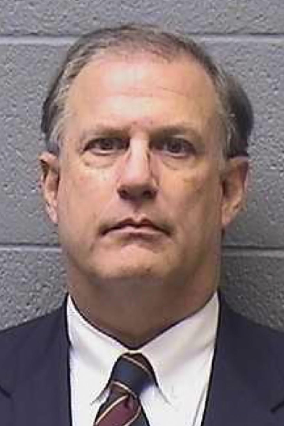 FILE - This Jan. 6, 2022, booking photo provided by the Midwest City, Okla., Jail shows Oklahoma House Speaker Pro Tempore Terry O'Donnell. Oklahoma Attorney General Gentner Drummond said Thursday, April 6, 2023, that he plans to drop all criminal charges against O’Donnell and his wife. O'Donnell was accused of misusing his power as a lawmaker to change state law so his wife could become a tag agent. (Midwest City Jail via AP, File)