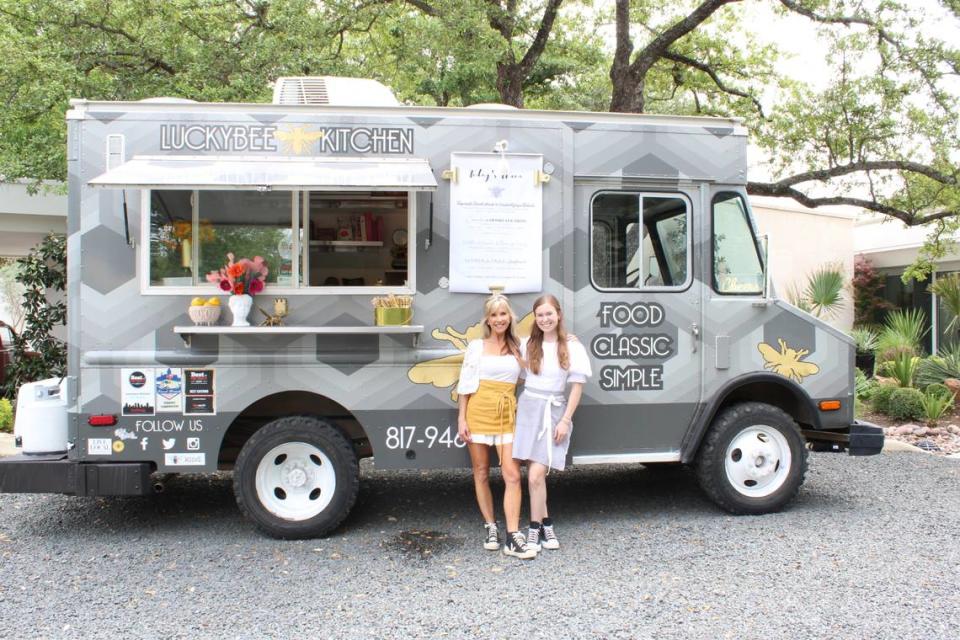 Jenny Castor, left, owner of Luckybee Kitchen, and daughter Albany Castor stand in front of the food truck in Fort Worth on April 18, 2024. The two usually work lunch catering events together.