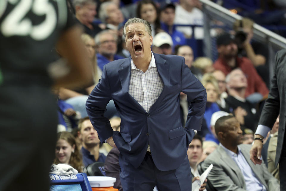 Kentucky head coach John Calipari yells to his team during the second half of an NCAA college basketball game against Marshall in Lexington, Ky., Friday, Nov. 24, 2023. (AP Photo/James Crisp)