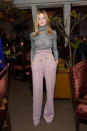 <p>Legs for days! Young Fanning looked ultra trendy in high-waisted mauve trousers and a tight tri-blend turtle neck from Rodarte’s Fall 2014 collection. It’s a far cry from her casual bohemian style, but it’s chic nonetheless. </p>