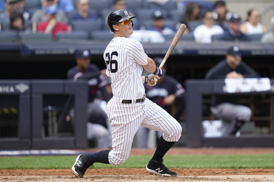 New York Yankees' DJ LeMahieu hits an RBI single off Minnesota Twins starting pitcher Pablo Lopez (49) in the third inning of a baseball game, Sunday, April 16, 2023, in New York. (AP Photo/John Minchillo)