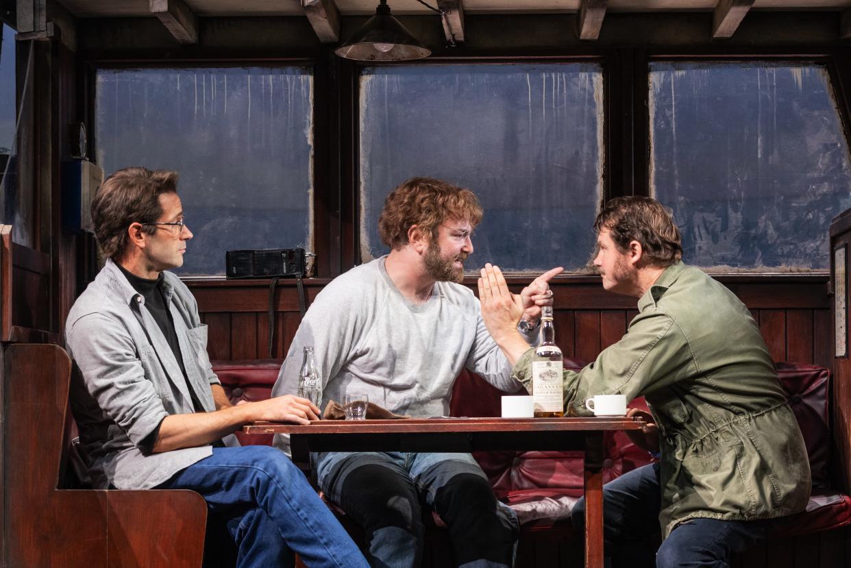 Roy Schneider (Colin Donnell, left) looks on as Richard Dreyfuss (Alex Brightman) and Robert Shaw (Ian Shaw) quarrel in a scene from "The Shark Is Broken."