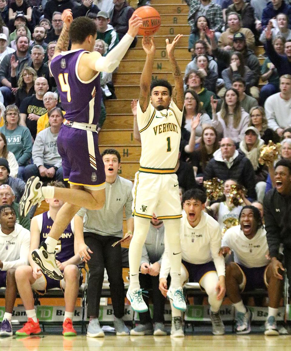 Vermont's Aaron Deloney shoots a 3-pointer during the Catamounts 75-72 win over Albany in the America East quarterfinals on Saturday afternoon at Patrick Gym.