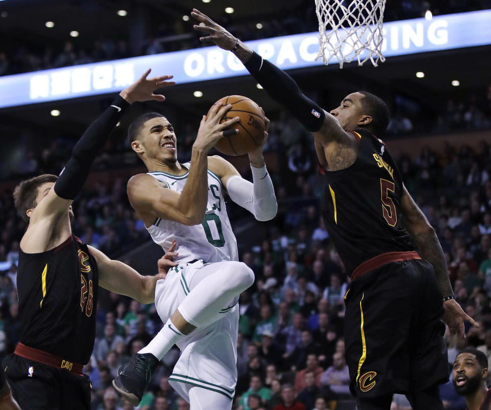 Celtics forward Jayson Tatum drives to the basket against the Cavaliers during the second quarter Wednesday night. (AP)