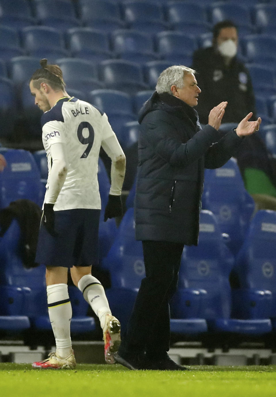 Tottenham's Gareth Bale, left walks past Tottenham's manager Jose Mourinho after being substituted during an English Premier League soccer match between Brighton and Tottenham Hotspur at the Amex stadium in Brighton, England, Sunday Jan. 31, 2021. (Andrew Boyers//Pool via AP)