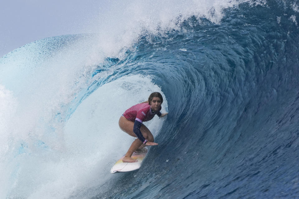 Caroline Marks, of the United States, surfs during the semifinal round of the surfing competition at the 2024 Summer Olympics, Monday, Aug. 5, 2024, in Teahupo'o, Tahiti. (AP Photo/Gregory Bull)