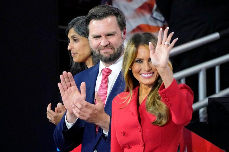 Melania Trump waves during the final day of the Republican National Convention at the Fiserv Forum. JD Vance and wife Usha Chilukuri Vance are at left. The final day of the RNC featured a keynote address by Republican presidential nominee Donald Trump.