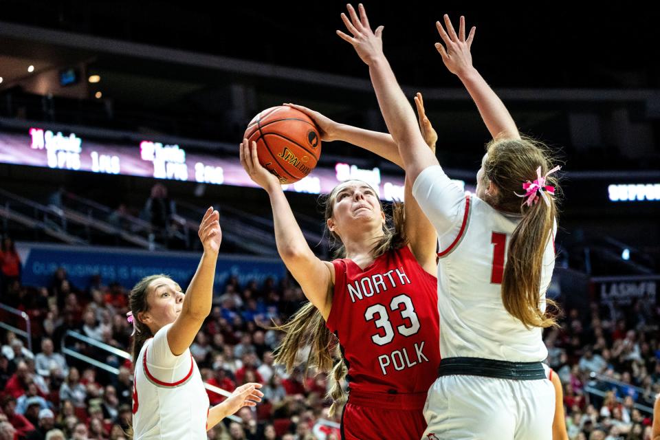 North Polk's Becca Aagard attempts a shot during the Iowa high school girls state basketball quarterfinals at Wells Fargo Arena on Tuesday. Aagard and the rest of her team advanced to the state semifinals with a 48-42 win over Dallas Center-Grimes.