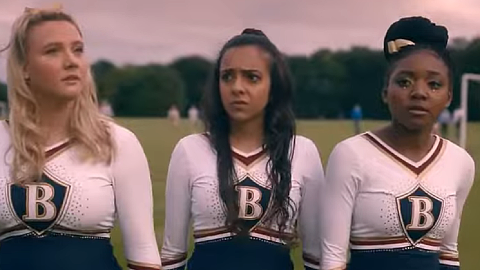 Asha Banks (middle) on Rebel Cheer Squad.