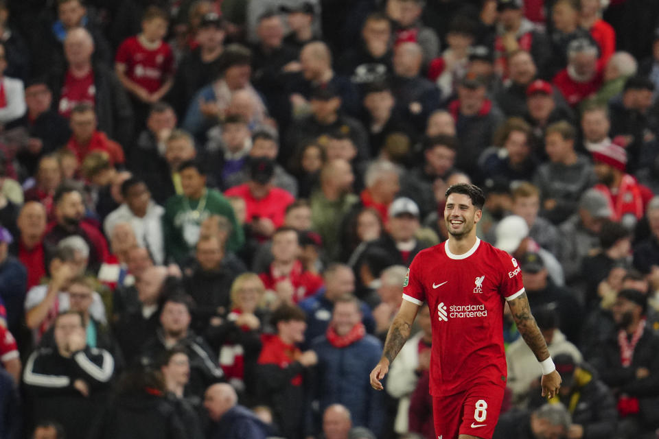 Liverpool's Dominik Szoboszlai celebrates after scoring his side's second goal during the English League Cup third round soccer match between Liverpool and Leicester City at the Anfield stadium in Liverpool, England, Wednesday, Sept. 27, 2023. (AP Photo/Jon Super)