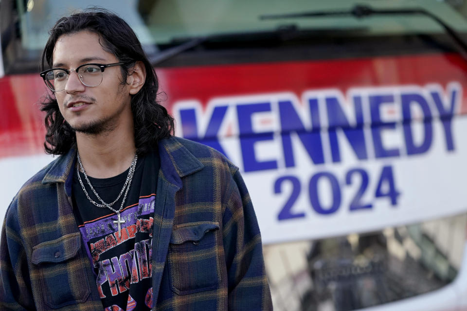 Christian Ortez waits in line to enter a voter rally for Independent presidential candidate Robert F. Kennedy Jr., Wednesday, Dec. 20, 2023, in Phoenix. (AP Photo/Matt York)