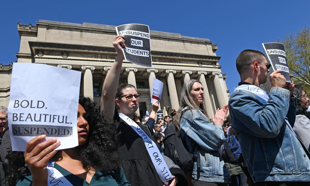 <span>Faculty members at Columbia hold a demonstration in support of student protesters on Monday.</span><span>Photograph: Andrea Renault/Zuma/Rex/Shutterstock</span>