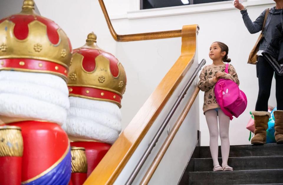 Seven-year-old Allie, who plays “baby bunny” in Sacramento Ballet’s “Nutcracker” production, leaves rehearsal after practicing with the adult company dancers for the first time Tuesday, Nov. 29, 2022, at their midtown Sacramento studios.