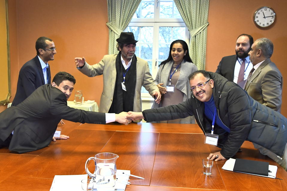 Abdelqader al-Murtada and Saelem Mohammed Noman Al-Mughalles, at left, representatives of the Houthi rebels delegation and to the right, Askar Zaeil and Hadi al-Hayi representing the delegation of the Government of Yemen together with representatives from the office of the UN Special Envoy for Yemen and the International Red Cross Committee (ICRC) during the ongoing peace talks on Yemen held at Johannesberg Castle, in Rimbo, north of Stockholm, Sweden, December 11, 2018. Yemen's government and the Houthi rebels are exchanging lists of prisoners as part of peace talks in Sweden aimed at winding down the devastating civil war. (Claudio Bresciani/TT via AP)