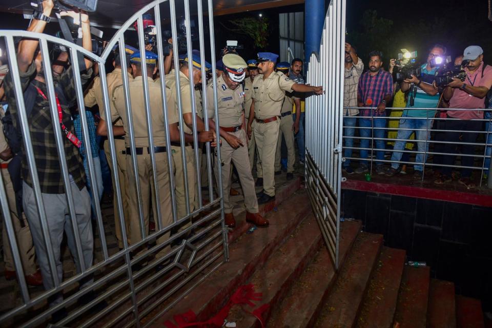 A police officer inspects the spot after a stampede at the venue of a music concert at the Cochin University of Science and Technology in Kochi, Kerala (AP)
