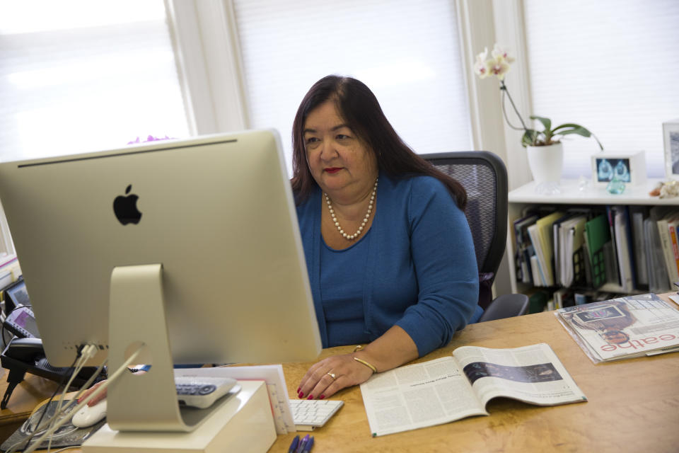 Jane Delgado, president of the National Alliance for Hispanic Health, works in her office in Washington, Monday, March 24, 2014. The nation’s largest minority group risks being left behind by President Barack Obama’s health care overhaul. Hispanics account for nearly one-third of the nation’s uninsured, but all signs indicate that they remain largely on the sidelines as the White House races to meet a goal of 6 million sign-ups with less than a week to enroll. (AP Photo/ Evan Vucci)