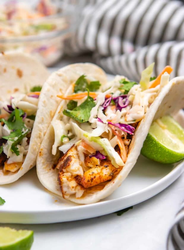 <p>Lemons and Zest</p><p>These air fryer fish tacos are ready from start to finish in about 15 minutes.</p><p><strong>Get the recipe: <a href="https://lemonsandzest.com/air-fryer-fish-tacos-with-cilantro-lime-slaw/" rel="nofollow noopener" target="_blank" data-ylk="slk:Air Fryer Tacos with Cilantro Lime Slaw;elm:context_link;itc:0;sec:content-canvas" class="link ">Air Fryer Tacos with Cilantro Lime Slaw</a></strong></p>