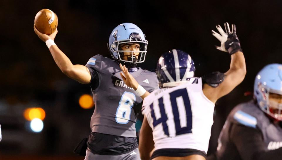 Granger’s quarterback Carson Su’esu’e passes the ball just ahead of Hunter’s Paula Makaafi as they play at Granger in West Valley City on Wednesday, Oct. 11, 2023. | Scott G Winterton, Deseret News