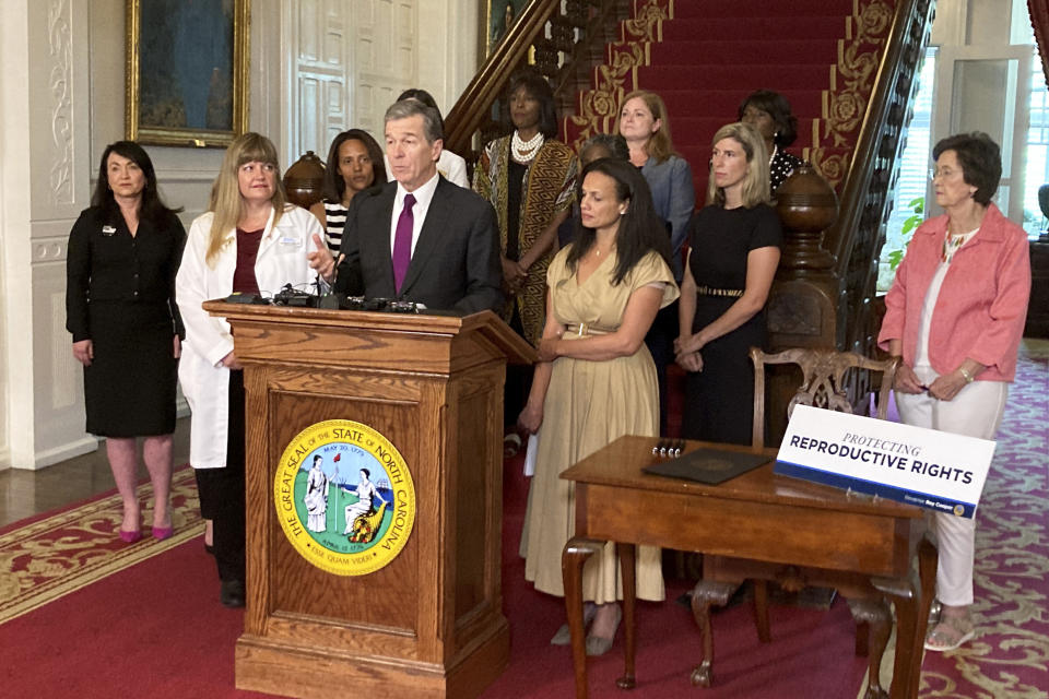 North Carolina Democratic Gov. Roy Cooper speaks at the Executive Mansion in Raleigh, N.C. on Wednesday, July 6, 2022, before signing an executive order designed to protect abortion rights in the state. The order in part prevents the extradition of a woman who receives an abortion in North Carolina but may live in another state where the procedure is barred. (AP Photo/Gary D. Robertson)