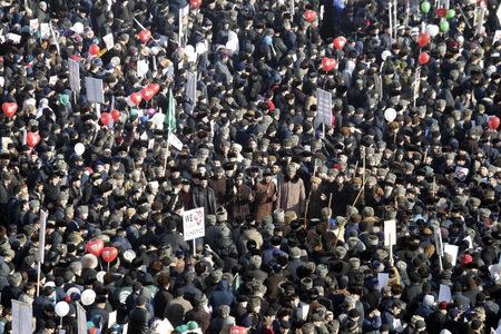 People attend a rally titled "Love for the Prophet Mohammad" to protest against satirical cartoons of the prophet, in Grozny, Chechnya January 19, 2015. REUTERS/Eduard Korniyenko