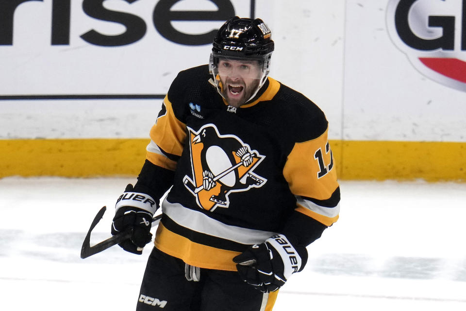 Pittsburgh Penguins' Bryan Rust (17) celebrates after scoring during the first period of an NHL hockey game against the Philadelphia Flyers in Pittsburgh, Sunday, Feb. 25, 2024. (AP Photo/Gene J. Puskar)